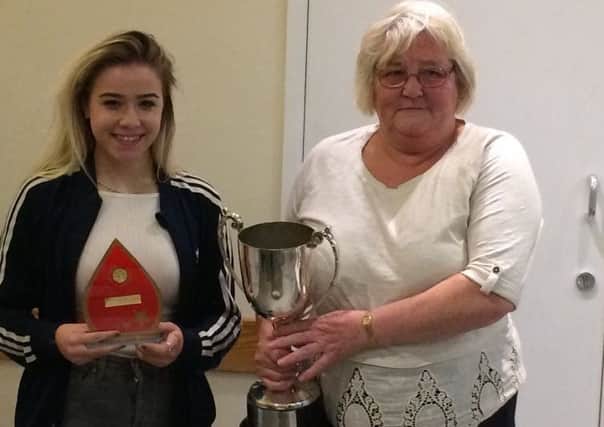 Elsie Pattenden, of West Hill Boxing Club, receives the Jimmy James Cup for the Sussex Boxer of the Year.