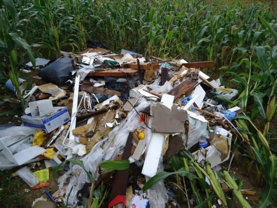 The fly-tipping in Squab Lane, Magham Down. Wealden District Council said access to farmland was blocked and on one occasion crops spoiled by the dumping of large amounts of renovation and house clearance waste.