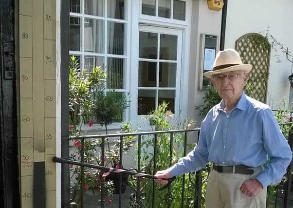 Frankie Kornicki, Findon's centenarian, with the percentage thermometer indicating the 48 per cent raised so far. Picture: Bob Eastabrook