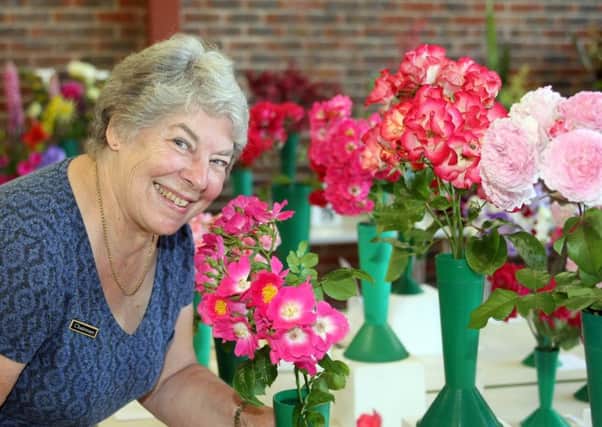 Felpham and Middleton Horticultural Society chairman Rhonda Ball at the rose and sweet pea show Photo by Derek Martin DM17629170a