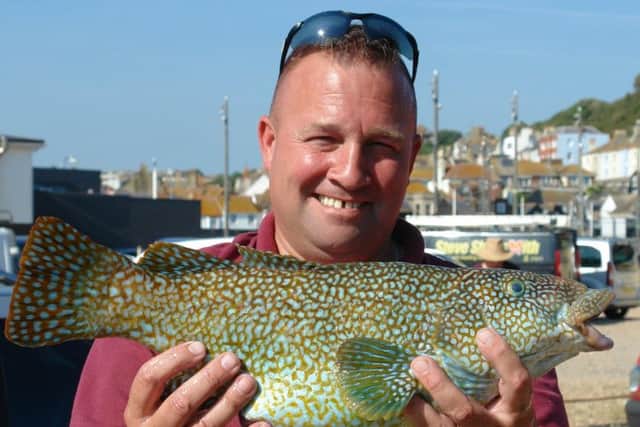 Barry Coleman clutches a wrasse.