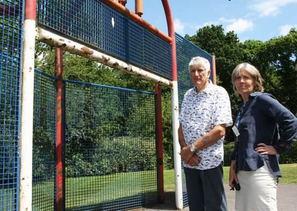 Midhurst county councillor Kate O'Kelly and resident Michael Ralph on 'dangerous' playground. Photo by Derek Martin.