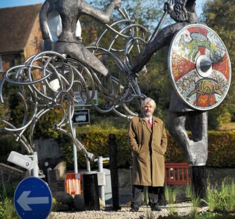 Sculptor Guy Portelli with the statue. Picture by Justin Lycett