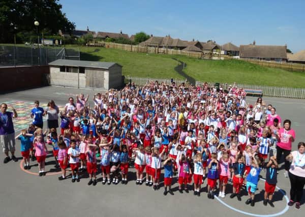 St Mary Magdalene Catholic Primary School pupils and staff held their very own Race For Life SUS-170621-150314001