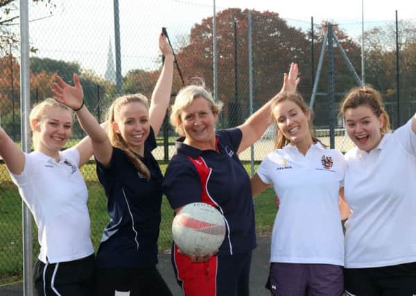 Jane Lomax and some of her netballers