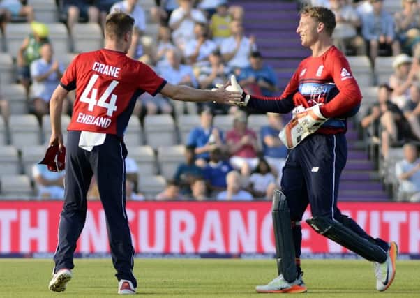 Mason Crane is congratulated on his spell by Jos Buttler / Picture by Neil Marshall