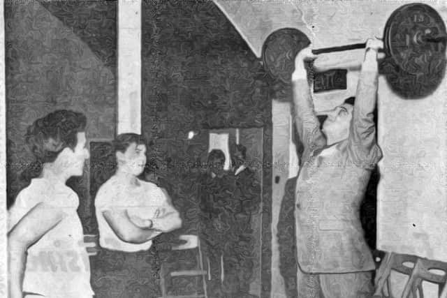 Frankie Vaughan lifting weights at Crawley Boys' Club