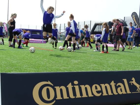 Schoolgirls being put through their paces at the Sussex FA Girls Football Festival