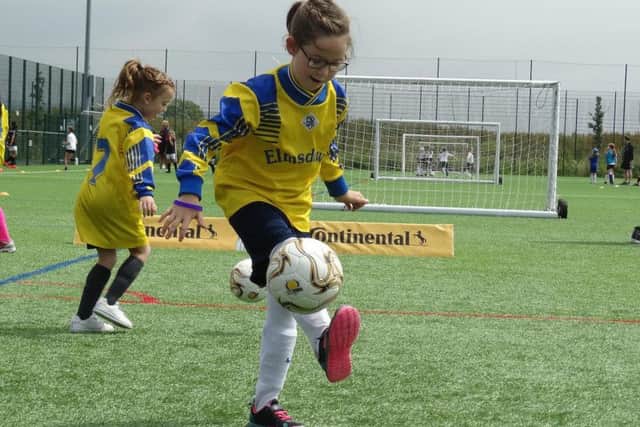 A young footballer shows off her skills