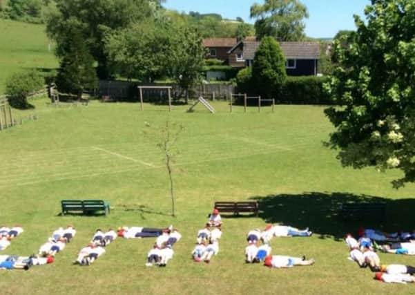 An aerial photograph was created, using the children to make the Unicef message