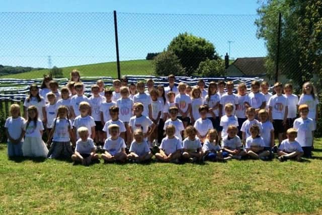 Pupils wore their new t-shirts for a walk around the village