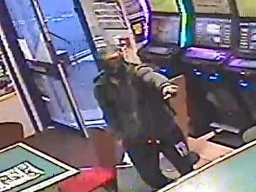 The suspect in the Bet Fred store (Photograph: Sussex Police)