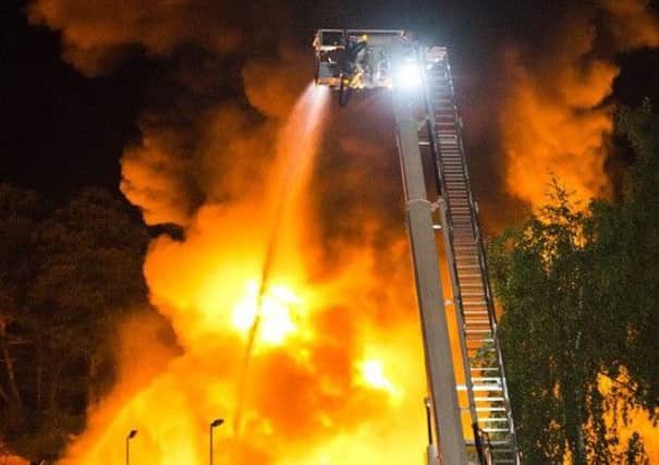 Around 60 firefighters tackled the huge blaze. Picture: Eddie Howland