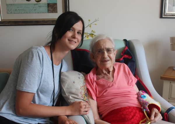 One of the butterfly support workers with a family member at Haviland House