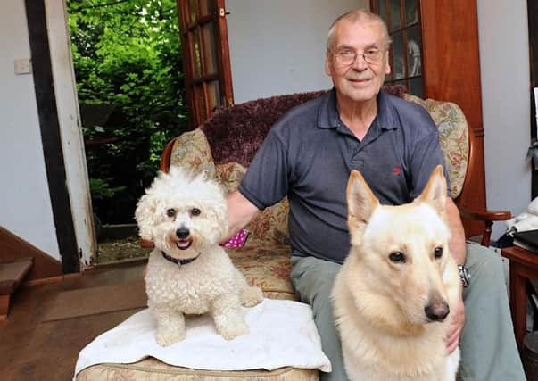 John Churchill faces a thousand pound fine and a criminal record for mess from his dog Shaka (right) that he cleared up. Picture: Stephen Goodger