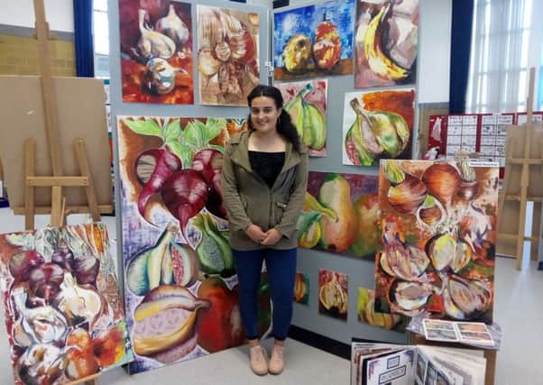 Hannah Stanaway with her exam work on a theme of fruit and vegetables