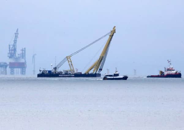 The Cormorant crane barge was been brought in from the Netherlands. Pictures: Eddie Mitchell