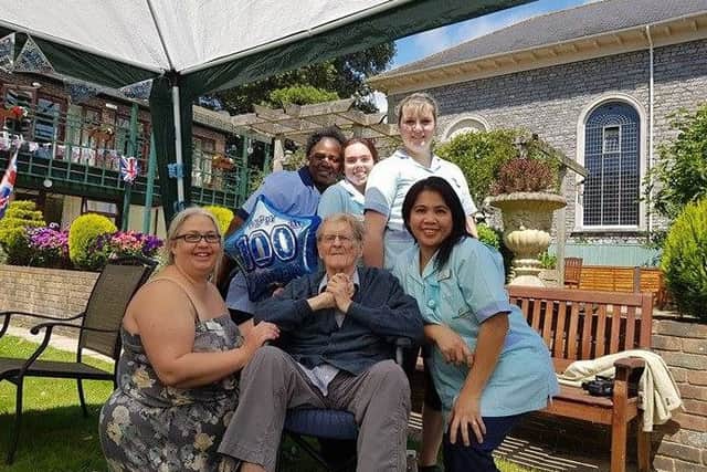 Michael Atkinson with staff at Marriott House and Lodge Care Home in Chichester