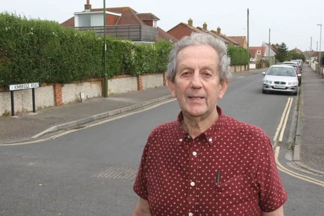 Bracklesham resident Anthony Goldsmith is angry with the parish council for refusing to object against plans to demolish a house (seen in the background) at the corner of Kimbridge Road and West Bracklesham Drive. Photo by Derek Martin