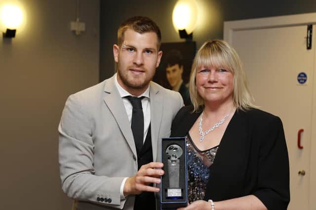 James Collins winner of Crawley Town Supporters Alliance Player of the Season is presented with his trophy by Carol Bates, chairman CTSA.
Picture by James Boardman/Telephoto Images