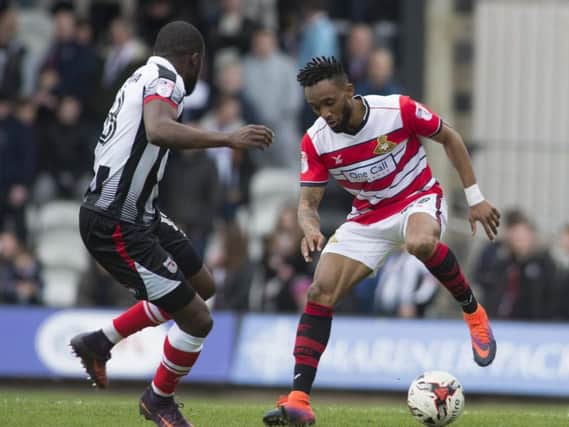 Cedric Evina in action for Doncaster Rovers