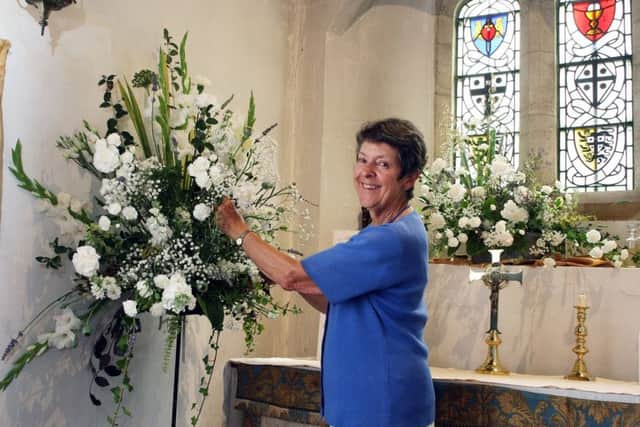 Rosemary Gregory with her white-themed arrangement, Confirmation DM17631866a