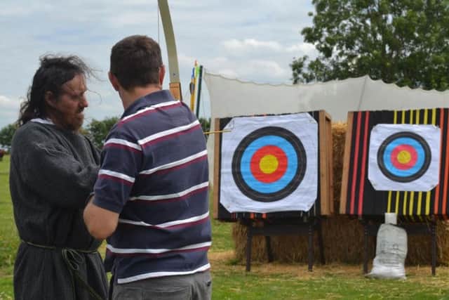 A member of the public trying his hand at the have-a-go archery