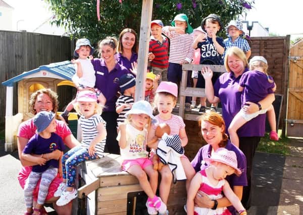 Ticklemetoo Community Playschool owner Zoe Duggan, left, with staff and children. Picture: Derek Martin DM17734217a