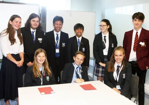 Amber Heard, 13, from Felpham Community College, seated far right, with her discussion group. Picture: Derek Martin DM17632650a