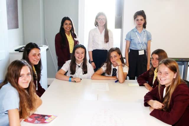 Year-eight students from different schools working together. Picture: Derek Martin DM17632644a