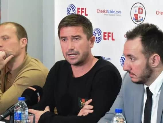 Crawley Town head coach Harry Kewell, middle, at his first press conference at the club and assistant Warren Feeney, left,  and director of football Selim Gaygusuz, right.
Picture by PW Sporting Photography.