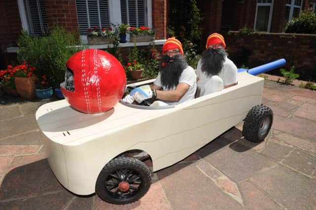 Ivor Vazquez (50) and Lee Calcott (35) in their cricket bat go-kart that they have been making at home for months to take part in th Red Bull soapbox go kart race (Photo by Jon Rigby)