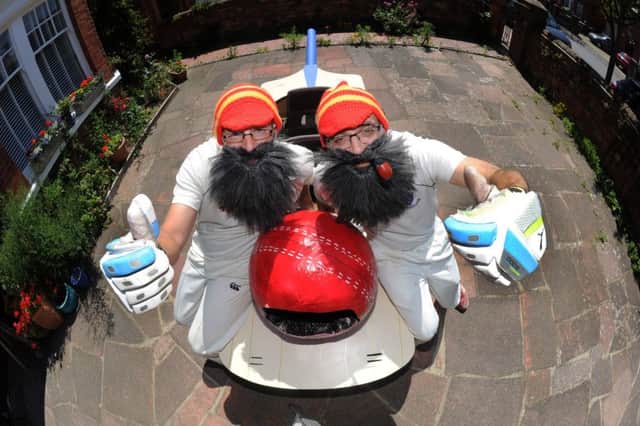 Lee Calcott (35) and Ivor Vazquez (50) in their cricket bat go-kart that they have been making at home for months to take part in th Red Bull soapbox go kart race (Photo by Jon Rigby)