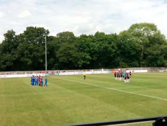 The Crawley Town and East Grinstead teams observe a minute's applause for six-year-old Bradley Lowery who died this week of a terminal illness.
Picture by Graham Carter