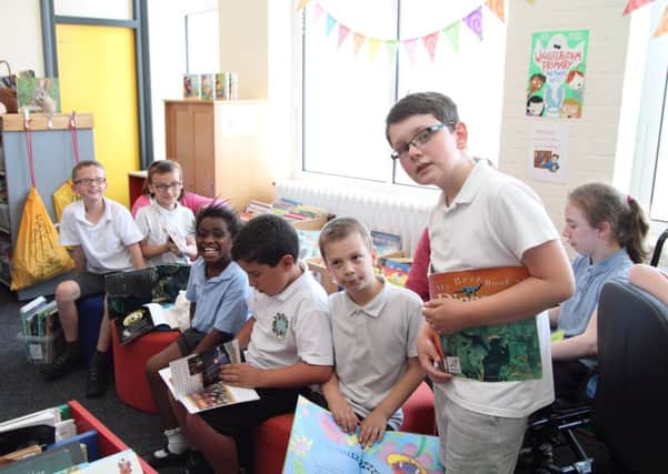 Pupils at Palatine Primary School get their first look at the new books. Picture: Mandy Short