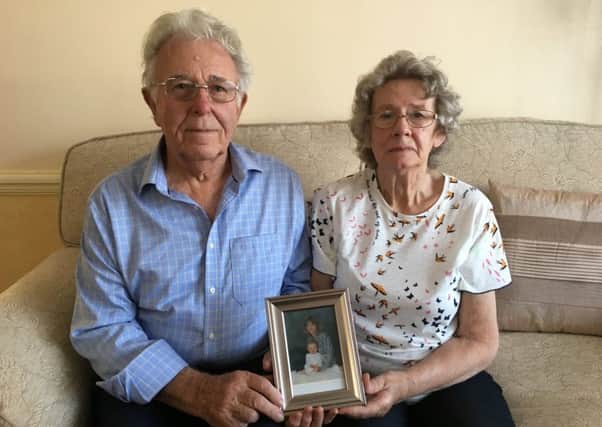 Peter and Elizabeth Skelton with a picture of their daughter Susan Nicholson