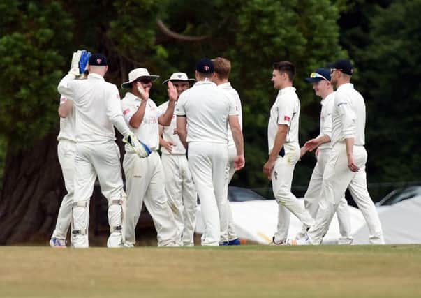Cricket: Sussex League Premier Division. Cuckfield V Horsham.   Action from the match.

Cuckfield's players celebrate. 

Picture: Liz Pearce 08/07/2017

LP170015 SUS-170807-205805008