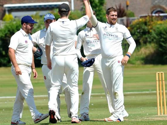 Chris Heberlein celebrates after taking a wicket on Saturday. Picture by Stephen Goodger