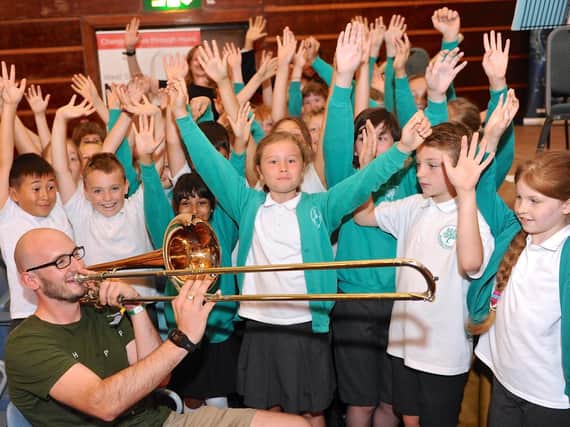 bass trombonist Sam Freeman and children from Bramber School - by Stephen Goodger