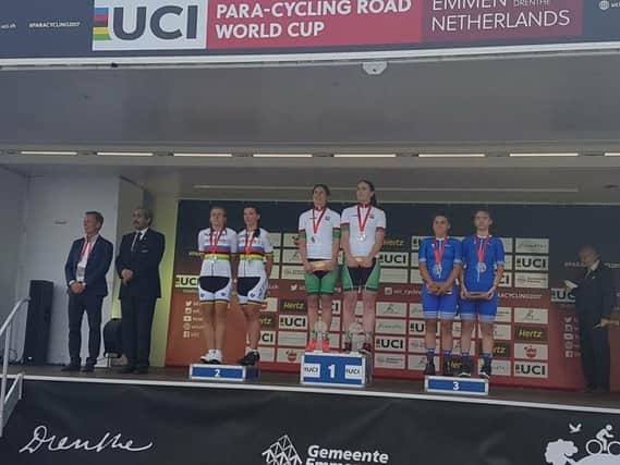 Katie-George Dunlevy being presented a gold medal after winning in the UCI Paracyling World Cup in Emmen in the Netherlands