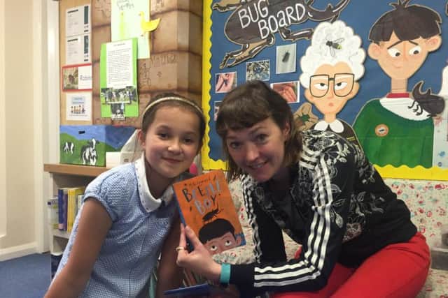Author M.G Leonard shows off her book 'Beetle Boy'