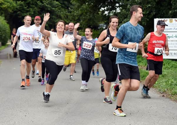Fishbourne Flat Five cross country race. 

Fishbourne Flat Five cross country race raising money for Chichester High School and the Apuldram Centre.

Pictured are runners at the start of the race. 
Fishbourne, West Sussex. 
Picture: Liz Pearce 16/07/2017
LP170200 SUS-170717-075708008