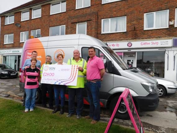 Gary and Jo present the cheque to Jane and Fraser Brooks from You Raise Me Up, at the charitys coffee shop in Polegate. Also pictured are Clive Austin and Peter Heneghan from Sussex depot.