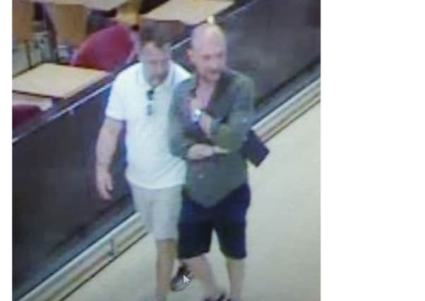CCTV image released by police of two men they want to speak to