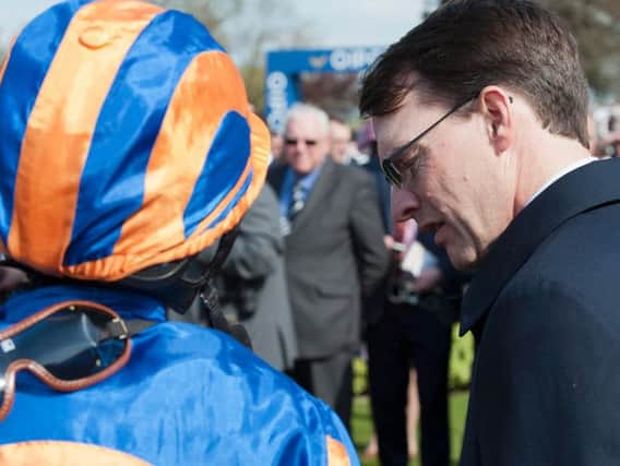 Aidan O'Brien briefs Ryan Moore at Newmarket - the trainer is Goodwood-bound for Glorious week