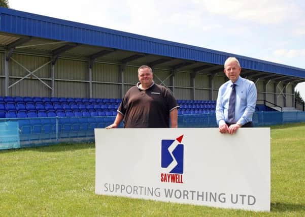 Chairman Steve Taylor and sponsor Peter Saywell by the memorial stand. Picture: Derek Martin