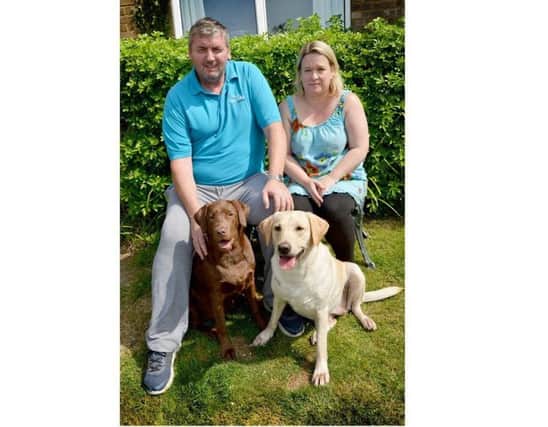 Naomi and John Barnes pictured with Maddie (left) and Lola. SUS-170719-101254001