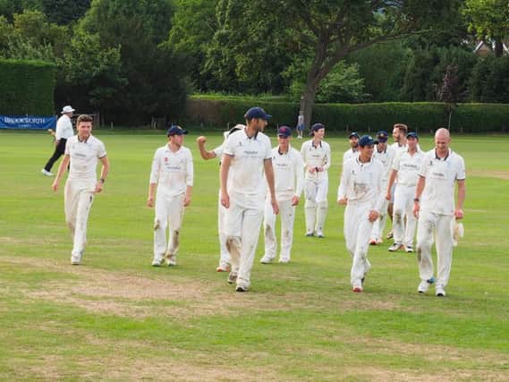 Delighted East Grinstead players leave pitch after beating Reigate Priory.
Picture contributed.