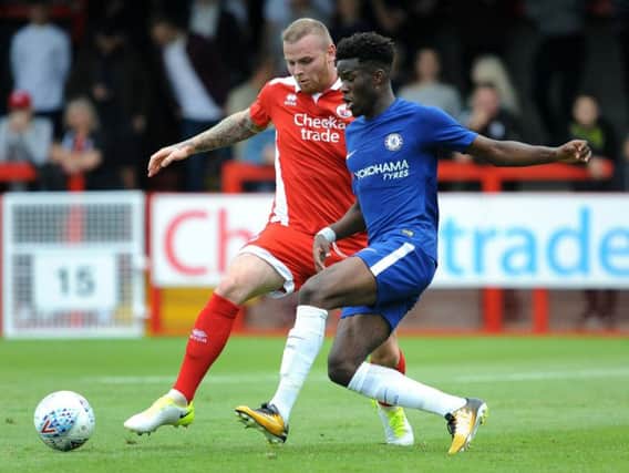 Crawley's Connolly puts in strong tackle on Chelsea starlet Ike Ugbo during 1-1 draw. Picture by Steve Robards.