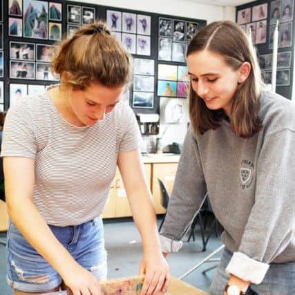 Lily Birnstingl and Amber Wright, both 15, working on screen printing. Photo by Derek Martin DM17735813a
